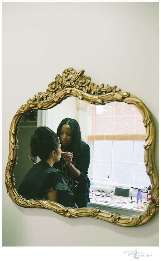 Bride getting her makeup done before the ceremony