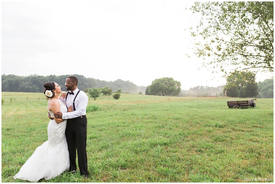 Bride and groom in field