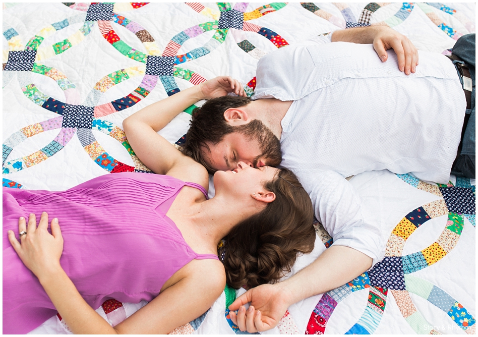 Couple laying on blanket for photos