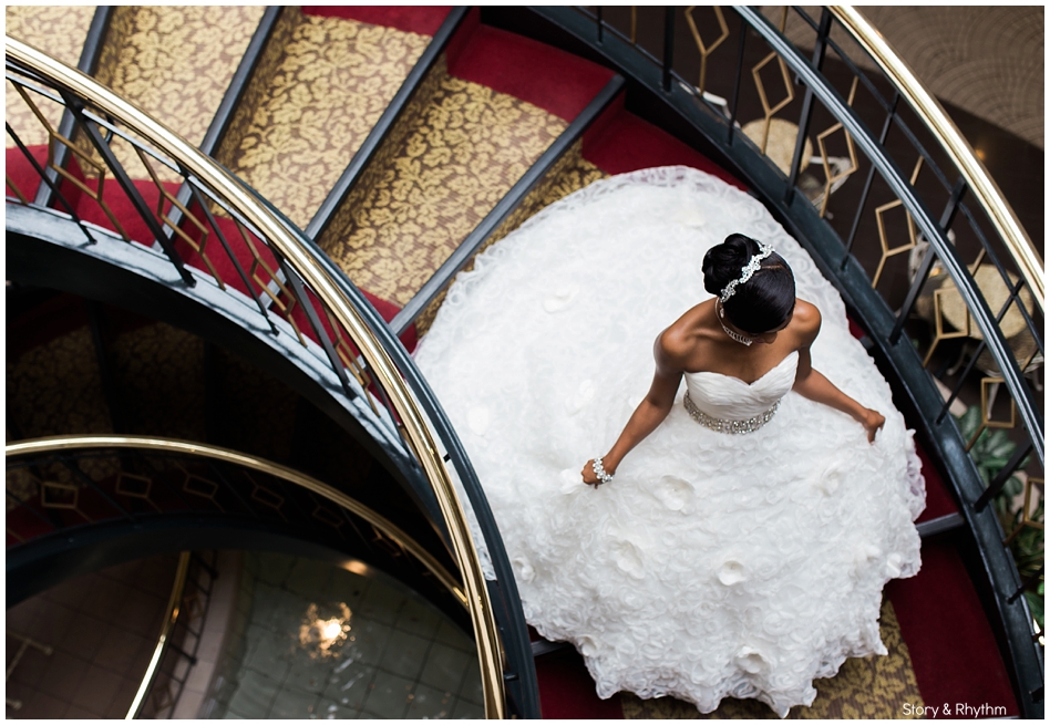 Bride running down staircase