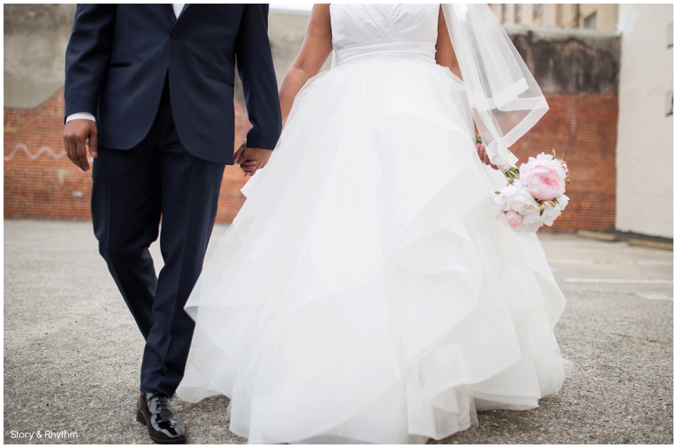Bride and groom holding hands