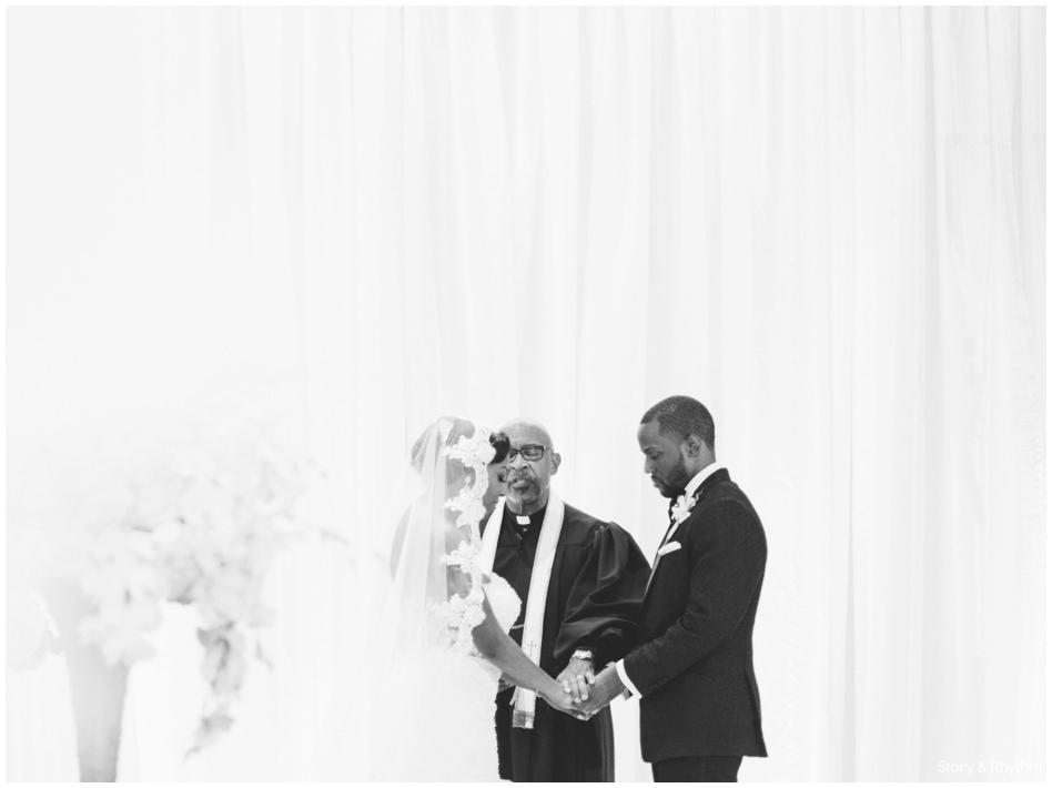 bride and groom praying at wedding ceremony