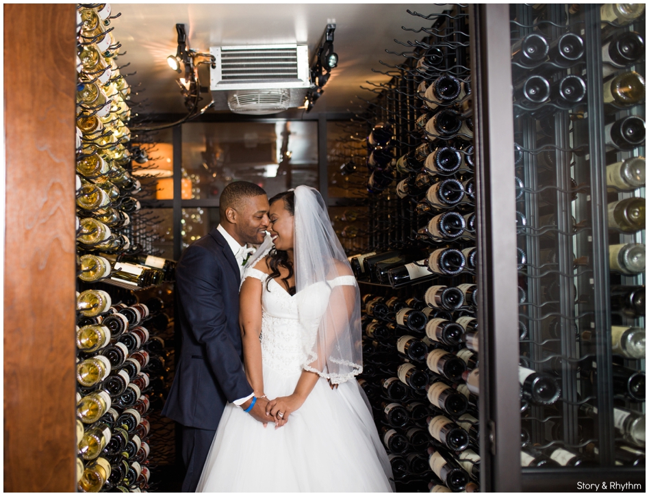Bride and groom portraits in wine cellar