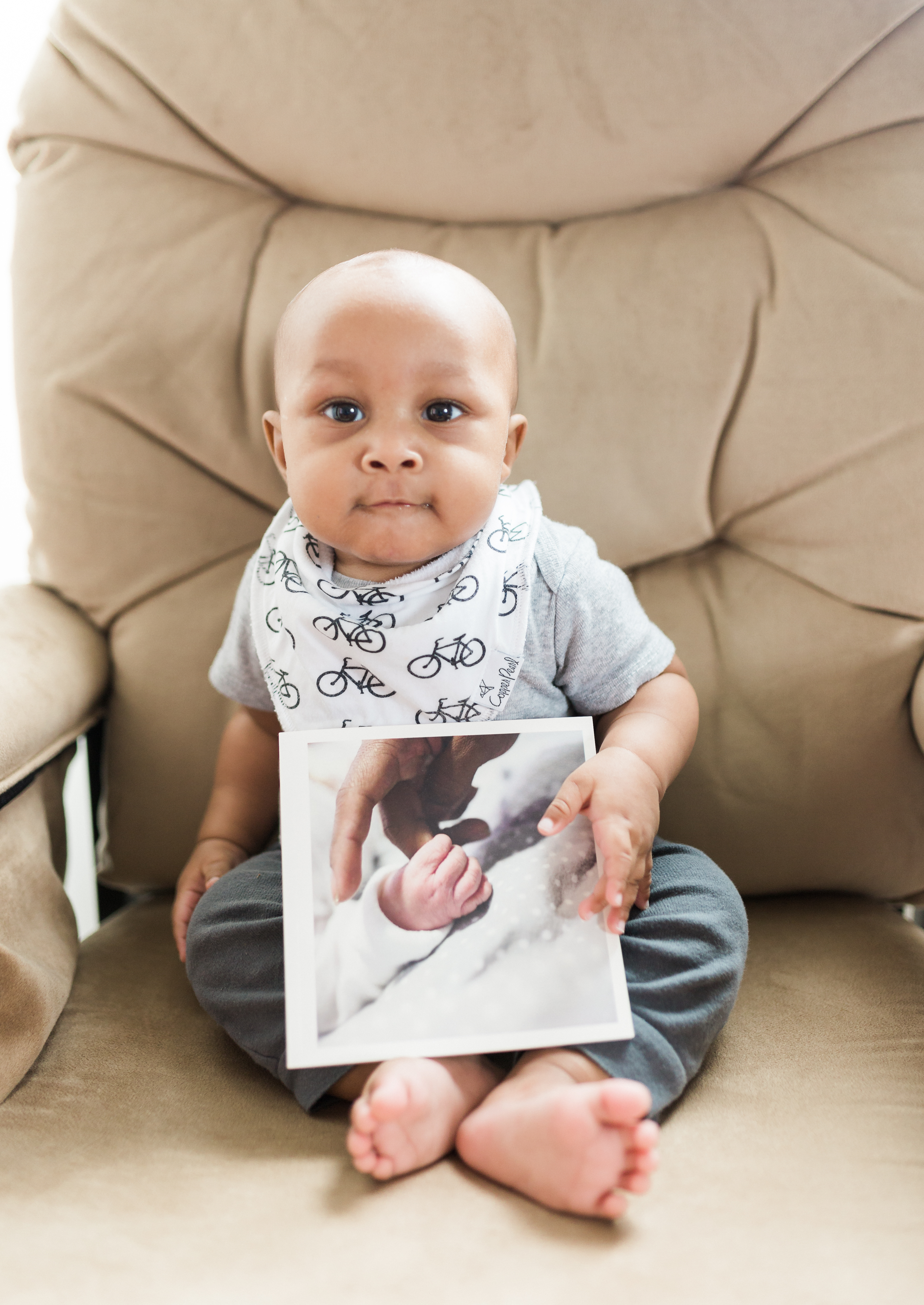 Baby holding chatbook